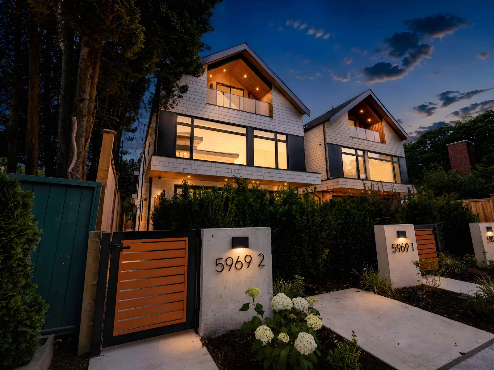 Twilight exterior of a modern Vancouver home with glowing windows and lit address numbers, photographed by Ready Set Sold Media