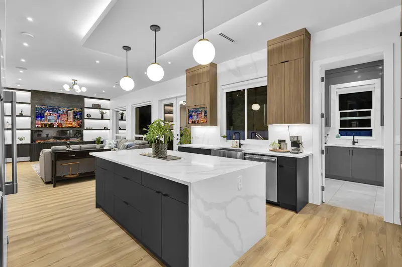 Open-concept kitchen flowing into family room in Langley listing photography