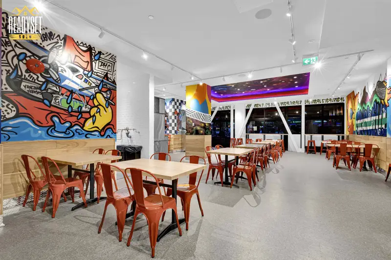 Dave's Hot Chicken colourful Vancouver-themed murals in the Granville St dining room