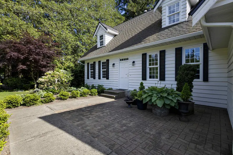 Front entry and paver walkway of a Langley detached home