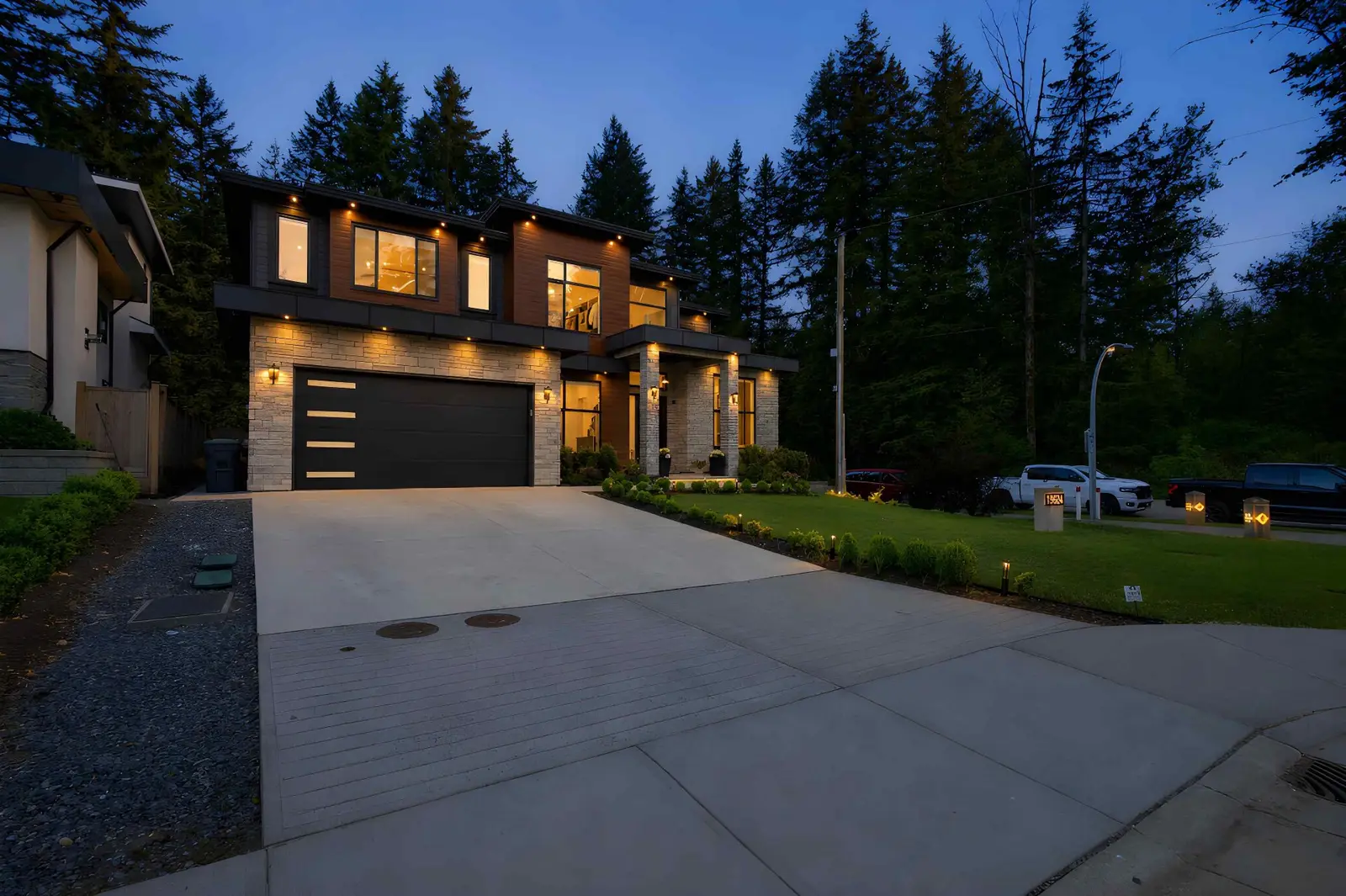 Twilight exterior of a luxury detached home at 19624 31A Avenue, Langley BC