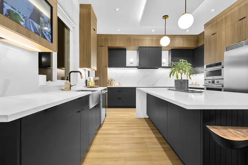 Detailed kitchen view with chef-style range hood and pantry features
