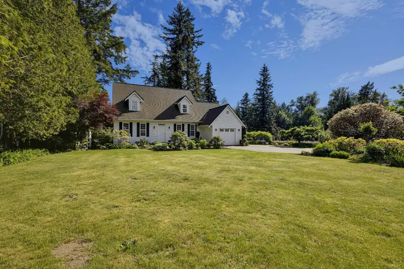 Front lawn and garden view of a detached home in Langley BC
