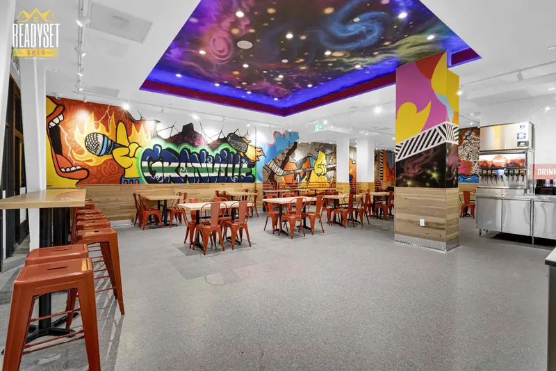 Dave's Hot Chicken Vancouver dining area with painted galaxy ceiling mural