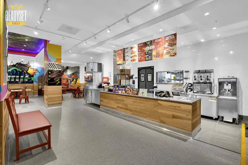 Restaurant branding photos of the Dave's Hot Chicken Granville St service counter