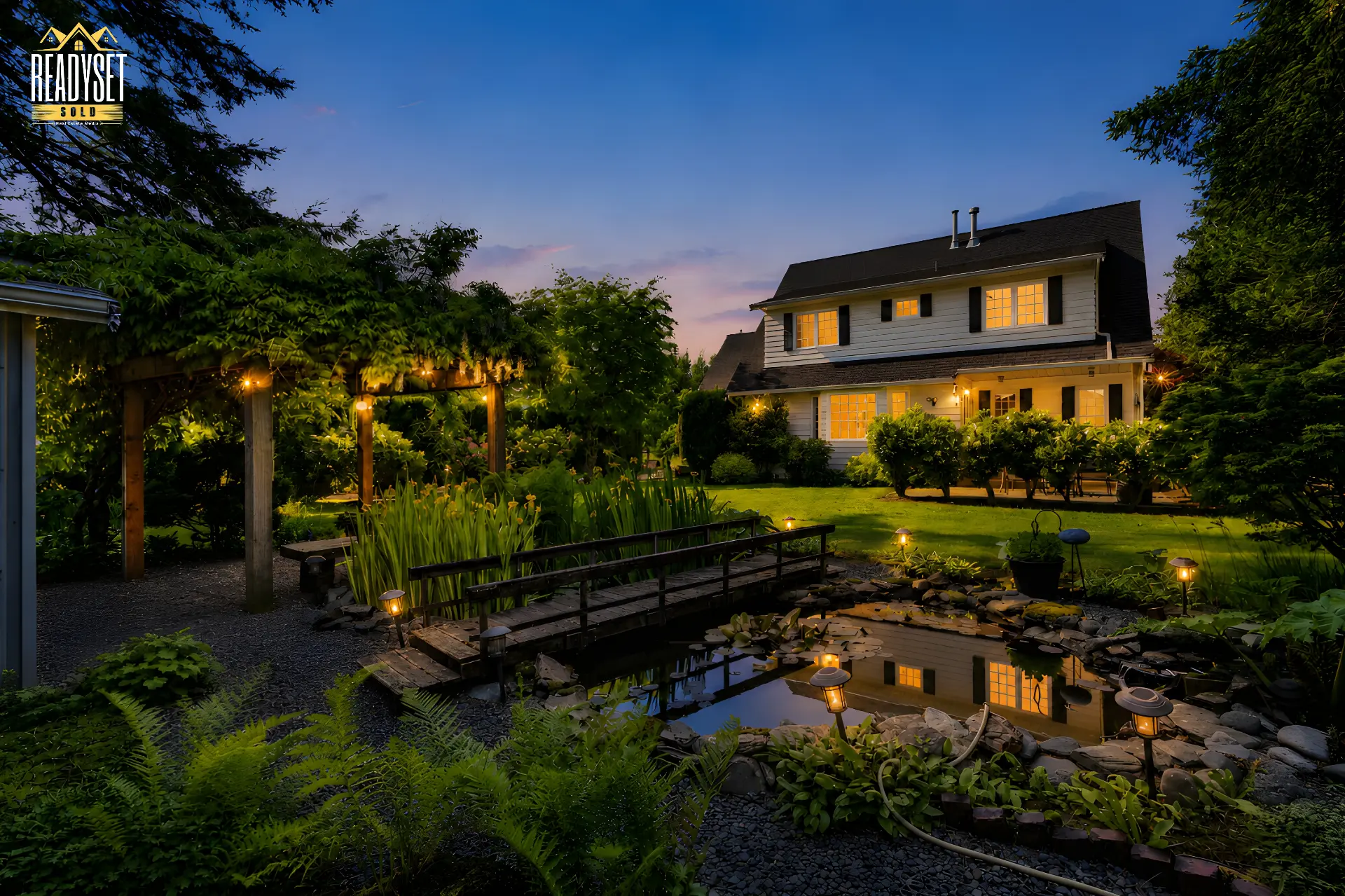 Twilight real estate photography of a landscaped Lower Mainland home with a lit garden and koi pond