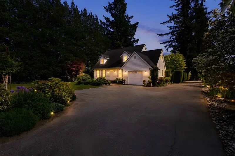 Twilight exterior of a detached home at 23430 50 Avenue, Langley BC